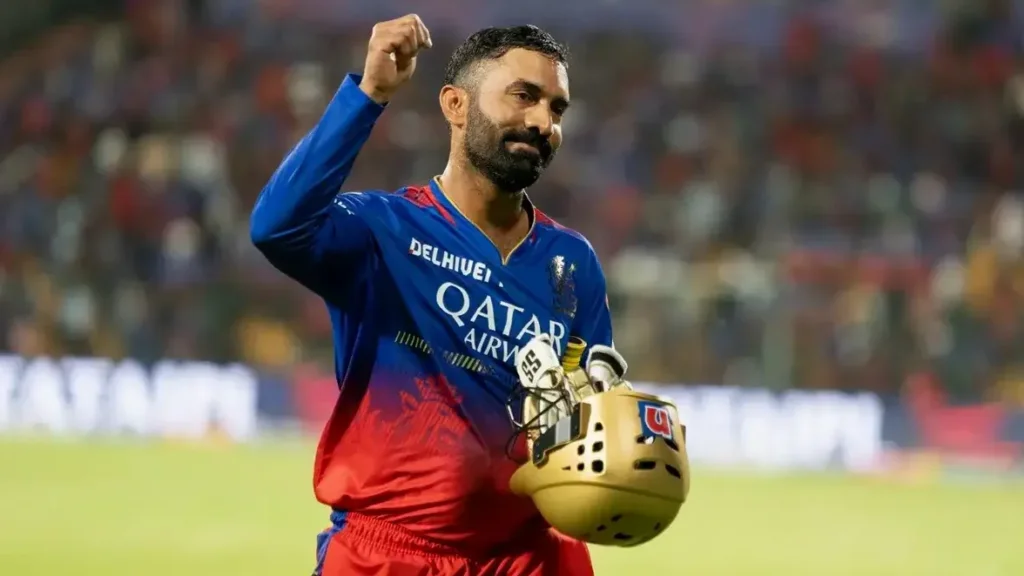 Dinesh Karthik in ground showing a winning gesture