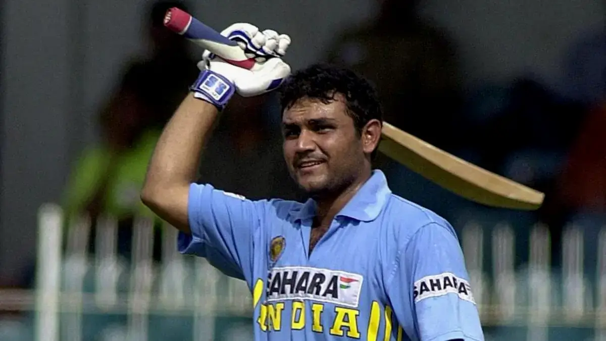 Virender Sehwag lifting bat after hiting half century